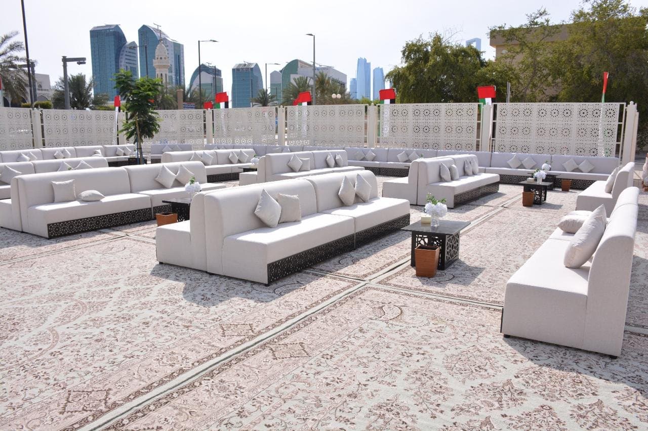 White outdoor seating against the city skyline