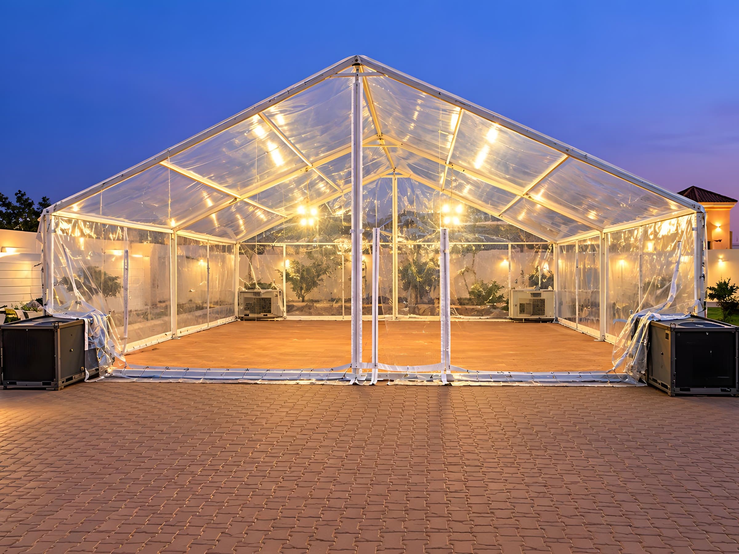 A dressed tent interior with round tables